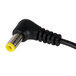 A black power cord with a yellow end.