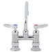 A chrome T&S deck-mounted faucet with two lever handles.
