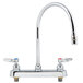 A T&S chrome deck-mounted workboard faucet with two lever handles.