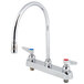 A chrome T&S deck-mounted workboard faucet with two silver lever handles.