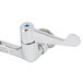 A silver Equip by T&S wall mounted faucet with wrist handles and a blue accent on one handle.
