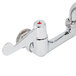 A chrome Equip by T&S wall mount faucet with wrist handles.