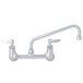 A T&S chrome wall mount faucet with lever handles and a swing spout.