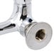 A chrome wall mounted T&S faucet with lever handles.