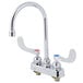 A T&S chrome deck-mounted workboard faucet with two wrist handles and 4" centers.