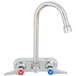 A T&S chrome wall mount faucet with lever handles and cerama cartridges.