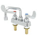 A white T&S deck-mounted workboard faucet with two wrist handles and a swing spout.
