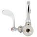 A T&S stainless steel wall mounted faucet with a red wrist handle.
