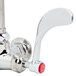 A chrome T&S wall mounted faucet with a red wrist handle.