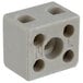 A white plastic terminal block cube with four holes.