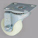 A close-up of an Avantco swivel plate caster with a metal and white plastic wheel.