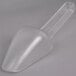 A Rubbermaid clear plastic bar scoop on a white surface.