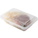 A clear GET reusable plastic container with food inside.