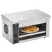A Vollrath countertop cheese melter with nachos on a plate.