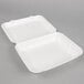 Two white Genpak styrofoam containers with hinged lids.