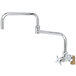 A T&S chrome deck-mounted faucet with a lever handle and double-jointed swing spout.