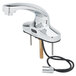 A T&S chrome hands-free sensor faucet with supply lines.