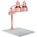 A Hanson Heat Lamps bright copper carving station with dual lamps on a white solid base.