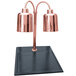 A Hanson Heat Lamps bright copper carving station with black synthetic granite base and two copper lamps.