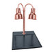 A Hanson bright copper carving station with two lamps above on a black synthetic granite base.