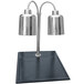 A Hanson Heat Lamps stainless steel carving station with black synthetic granite base and two silver lamps over a black surface.