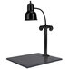 A Hanson Heat Lamps black carving station lamp on a black synthetic granite base.