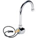 A chrome Equip by T&amp;S wall mounted sensor faucet with a swivel gooseneck spout.