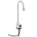 A chrome T&S hands-free faucet with supply lines attached.