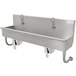 A stainless steel Advance Tabco hand sink with knee-operated faucets.