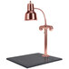 A Hanson bright copper carving lamp on a black synthetic granite base.