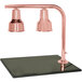 A Hanson Heat Lamps bright copper carving station with two lamps on a synthetic granite base.
