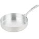 A silver Vollrath saute pan with a handle.