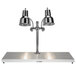 A Hanson Heat Lamps chrome carving station with two lamps above a stainless steel base.
