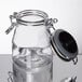 A Tablecraft glass jar with a metal clip-top lid.