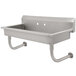 A stainless steel Advance Tabco multi-station hand sink with two hooks on the side.