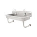 A stainless steel Advance Tabco multi-station hand sink with 5 electronic faucets.