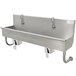 A stainless steel Advance Tabco hand sink with knee operated faucets.