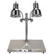 A Hanson Heat Lamps chrome carving station with two lamps over a stainless steel base.
