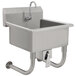 A stainless steel Advance Tabco hand sink with a knee operated faucet.
