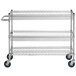 A chrome Regency utility cart with two baskets and one shelf on wheels.