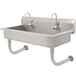 A stainless steel Advance Tabco multi-station hand sink with 5 electronic faucets.