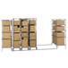 A Metro qwikTRAK stainless steel double deep stationary shelving unit with boxes on the shelves.
