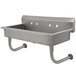 A stainless steel Advance Tabco multi-station hand sink with two holes in the back.
