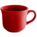 A close-up of a Tuxton cayenne red coffee cup with a handle.