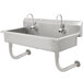 An Advance Tabco stainless steel hand sink with four electronic faucets.