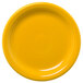 A yellow Fiesta® appetizer plate with a circular pattern and a white line around the rim.
