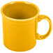 A yellow Fiesta china java mug with a handle.