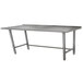 An Advance Tabco stainless steel work table with an open base and long metal top.