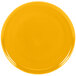 A yellow plate with a circle pattern on the rim.
