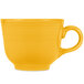 A yellow tea cup with a handle.